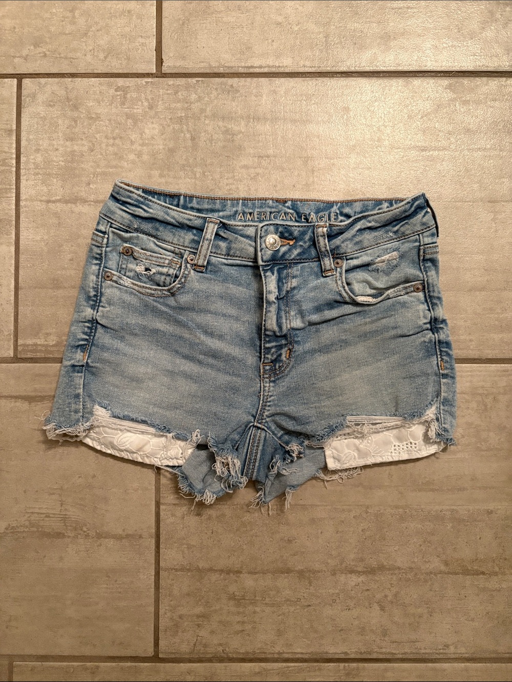 American Eagle Outfitters Light Wash Distressed Denim Shorts with Lace